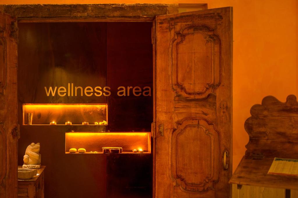 a door with the words wellness area written on it at Hotel Capo San Vito by Geocharme in San Vito lo Capo