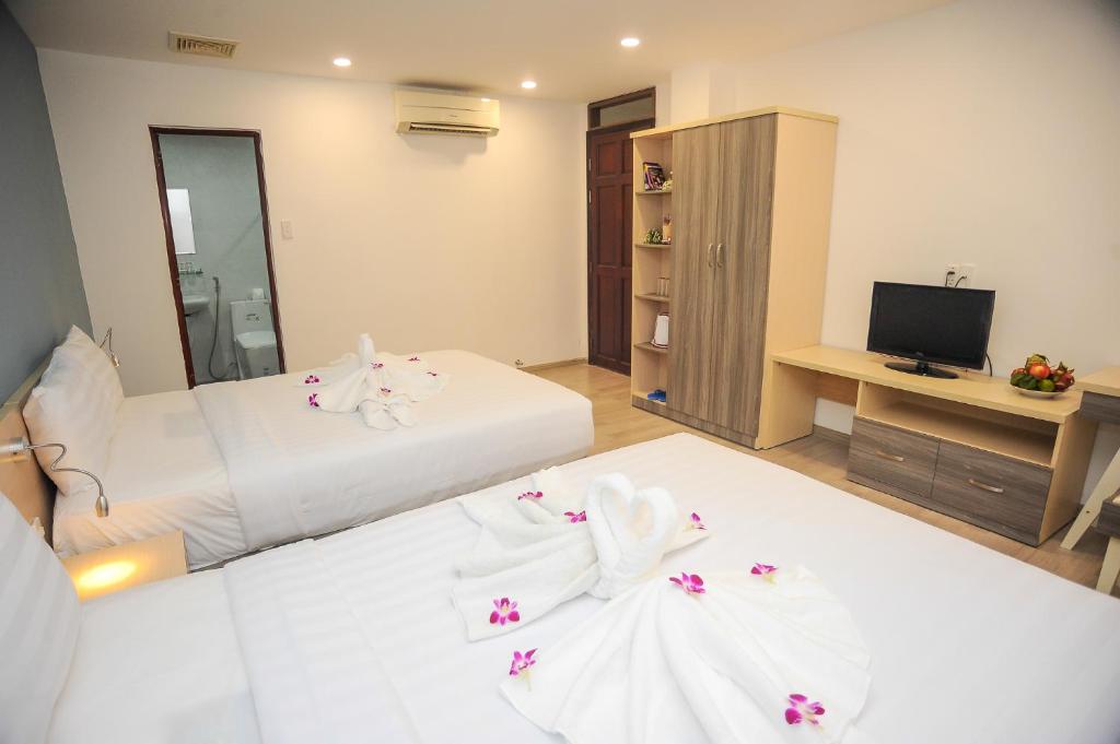 En eller flere senge i et værelse på My Anh 120 Central Saigon Hotel Ben Thanh Market