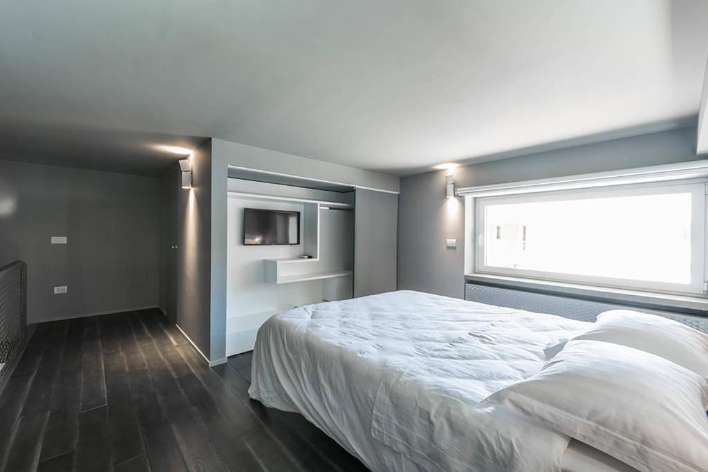 Postel nebo postele na pokoji v ubytování Grey Loft