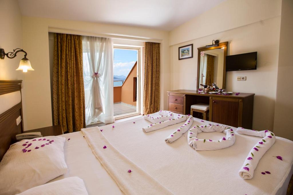 Postel nebo postele na pokoji v ubytování Valeri Beach Hotel