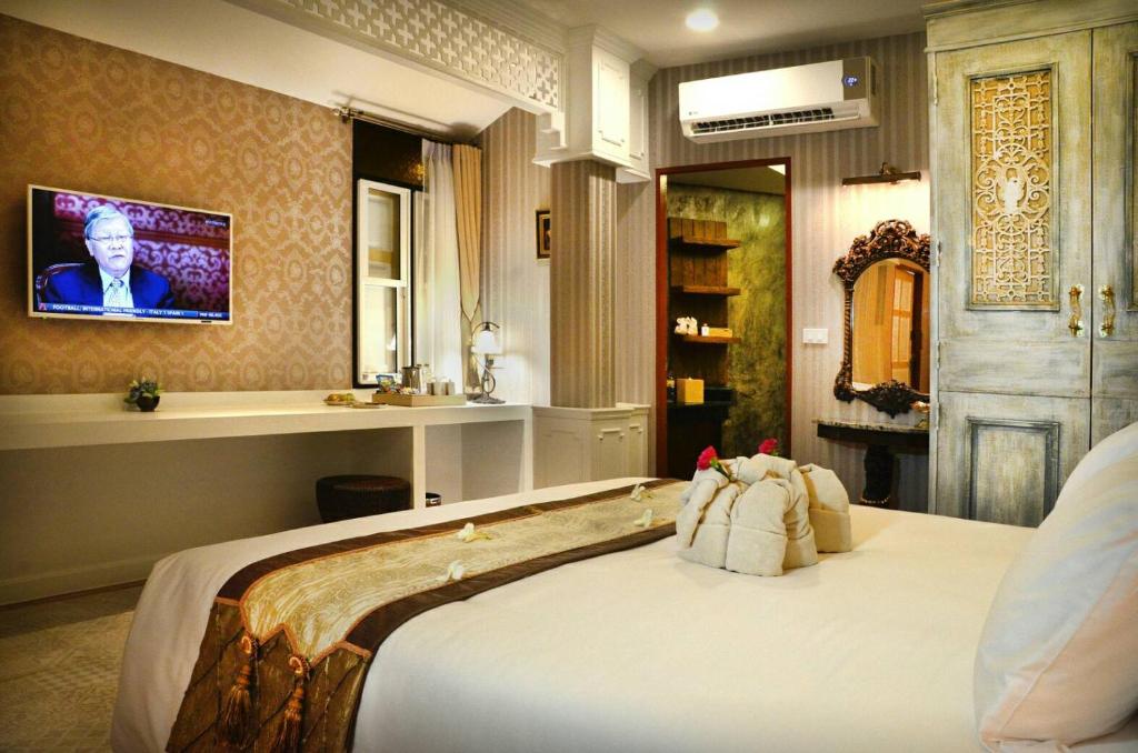 เตียงในห้องที่ ชูชัยบุรี ศรีอัมพวา