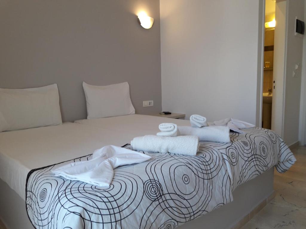 Postel nebo postele na pokoji v ubytování Katefiani Villas