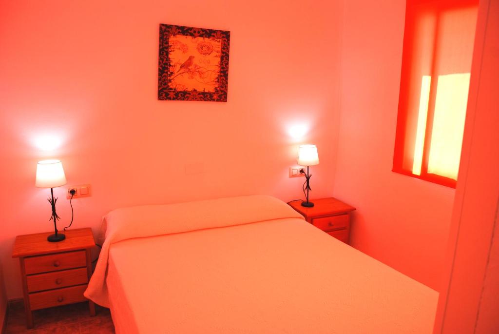 Posteľ alebo postele v izbe v ubytovaní Apartamentos Inter Gandia Playa