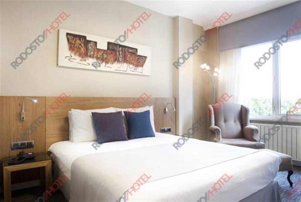 Postel nebo postele na pokoji v ubytování Rodosto Hotel