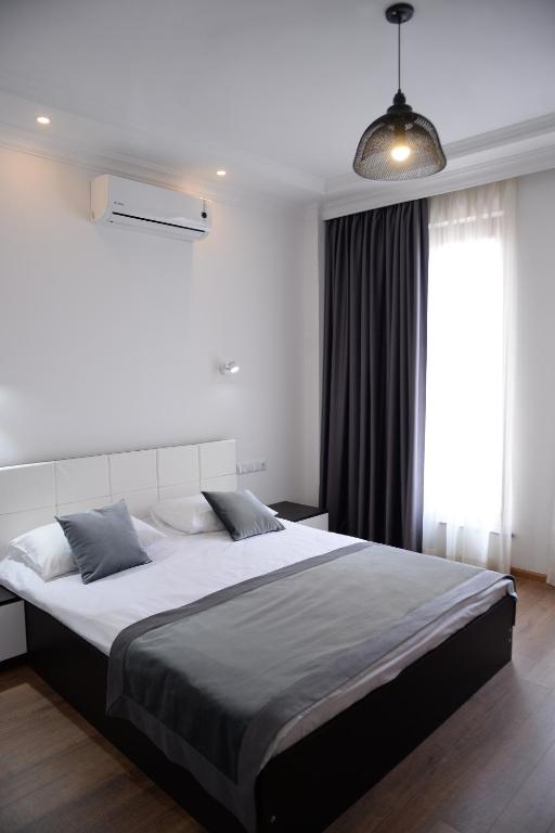 Postel nebo postele na pokoji v ubytování Guest House Gantiadi