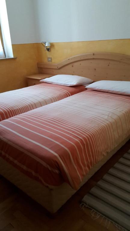 Postel nebo postele na pokoji v ubytování Hotel Vallecetta