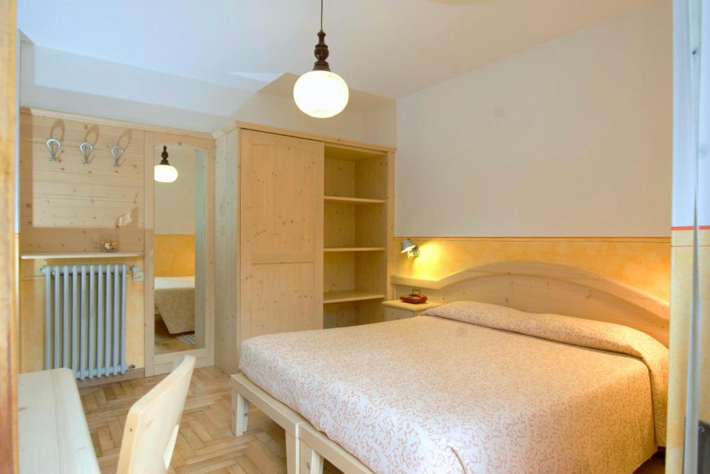 Postel nebo postele na pokoji v ubytování Hotel Vallecetta