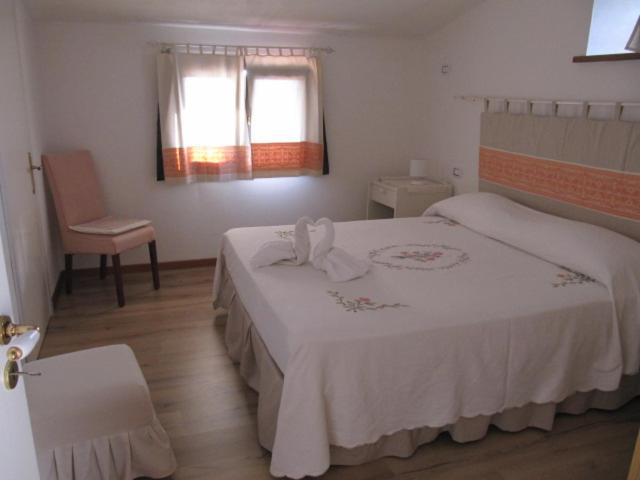 Postel nebo postele na pokoji v ubytování B&B I Limoni