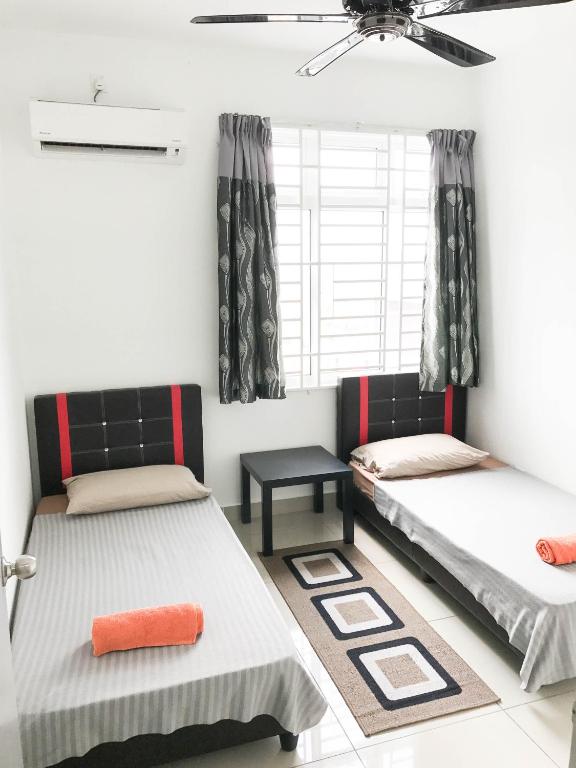 Postel nebo postele na pokoji v ubytování Palm Homestay Dwiputra Putrajaya