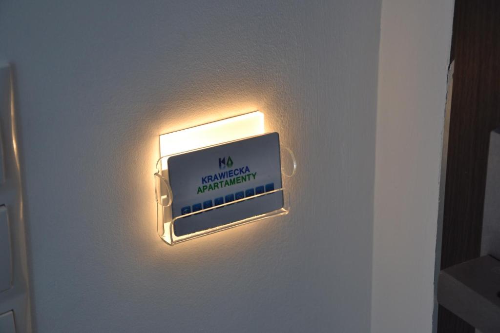 Certyfikat, podpis lub inny dokument wystawiony w obiekcie Apartamenty Krawiecka