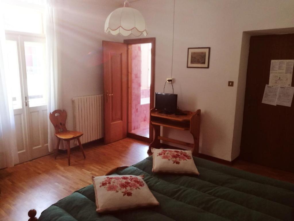 Posteľ alebo postele v izbe v ubytovaní Hotel Fiames