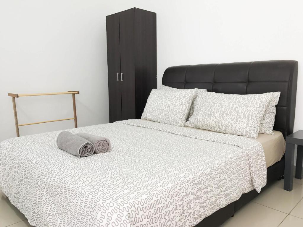 Postel nebo postele na pokoji v ubytování Palm Homestay Dwiputra Putrajaya