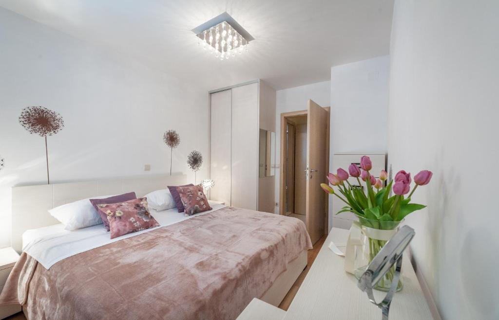 Posteľ alebo postele v izbe v ubytovaní Apartment Timea