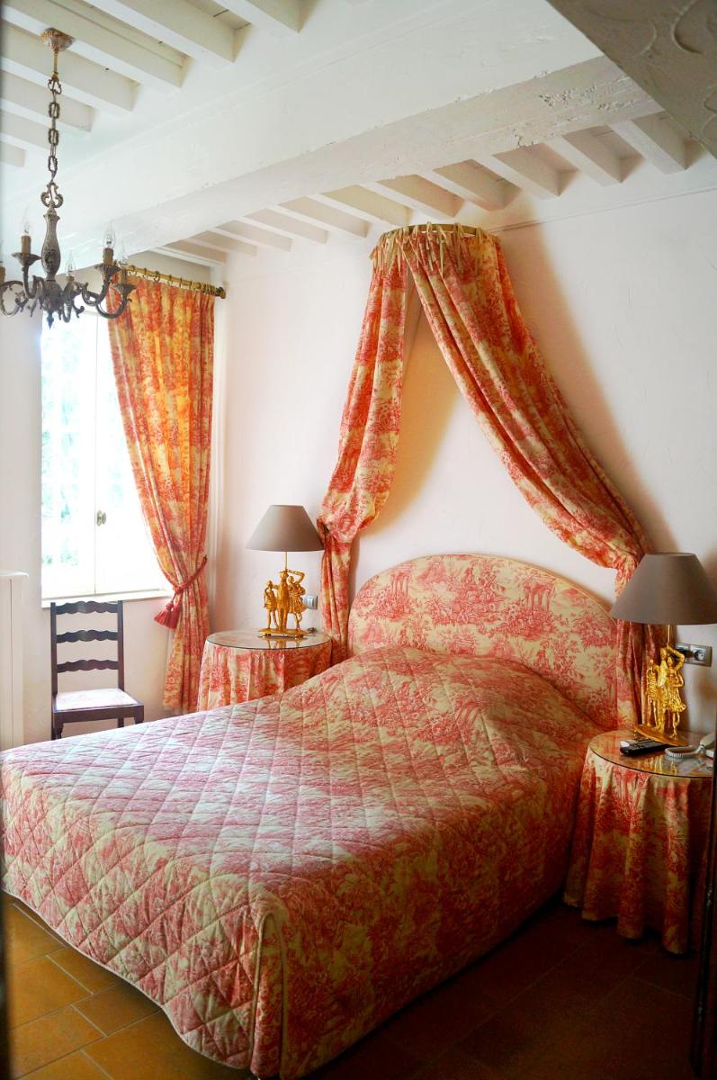Un ou plusieurs lits dans un hébergement de l'établissement Château de Fleurville & Spa