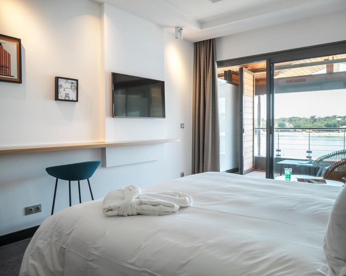 Un ou plusieurs lits dans un hébergement de l'établissement Hôtel & Spa Villa Seren