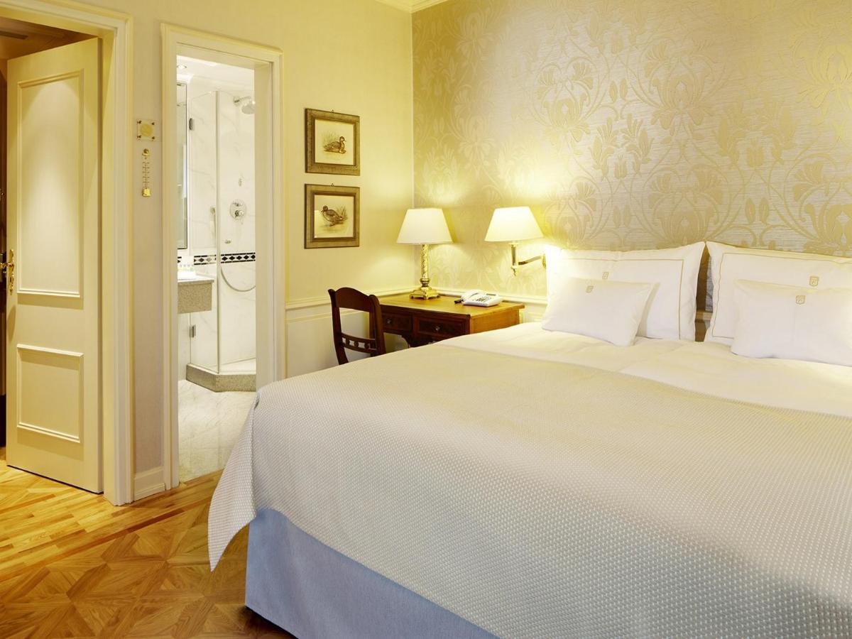 Ein Bett oder Betten in einem Zimmer der Unterkunft Colombi Hotel