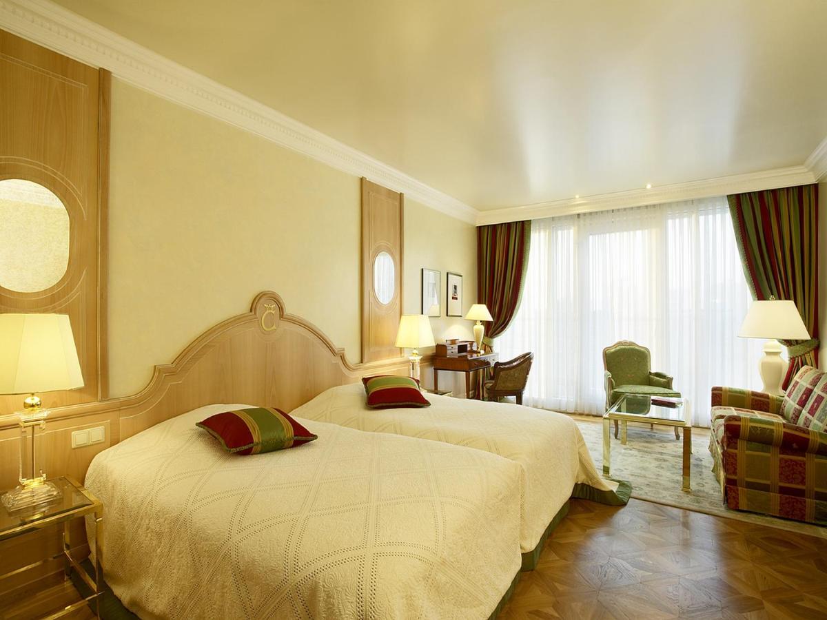 Ein Bett oder Betten in einem Zimmer der Unterkunft Colombi Hotel