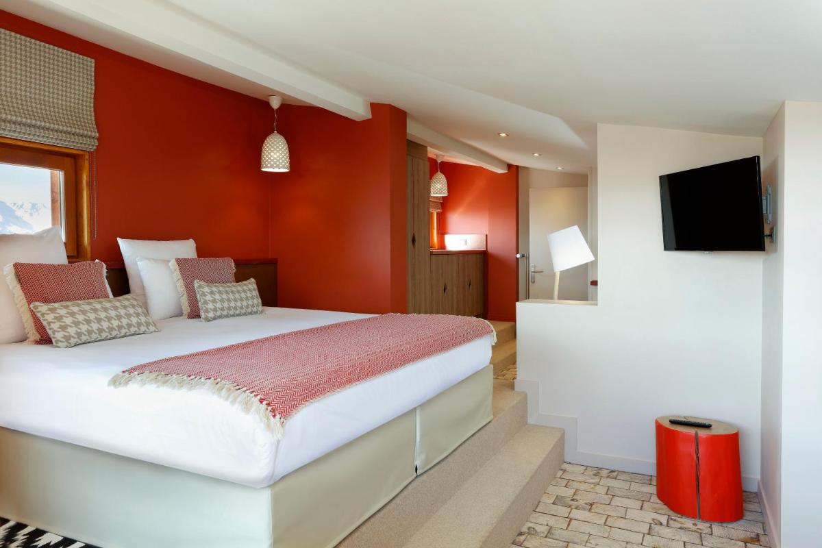 Un ou plusieurs lits dans un hébergement de l'établissement Grandes Rousses Hotel & Spa