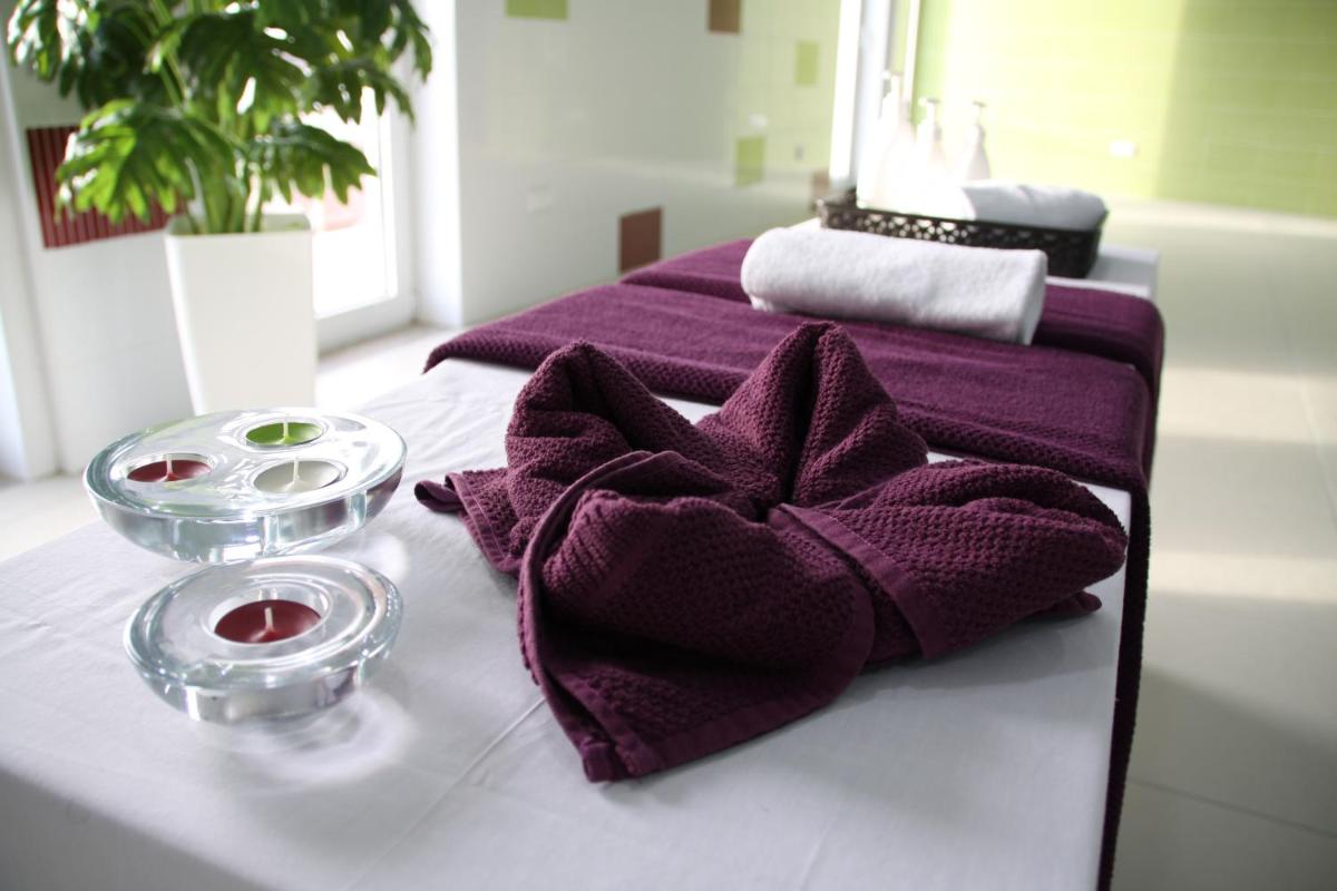 Uma cama ou camas num quarto em Palace Hotel & SPA Termas do Bicanho