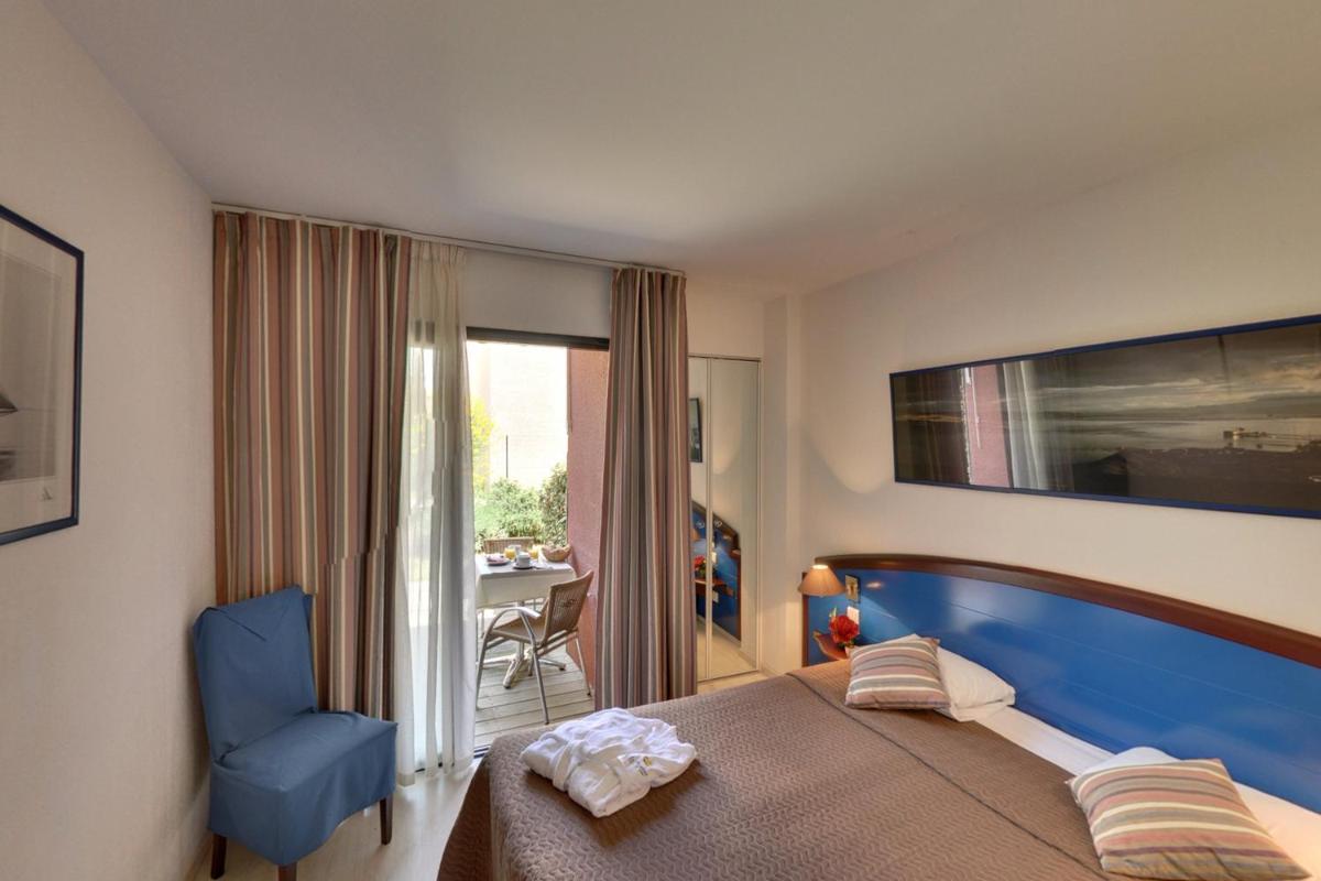 Un ou plusieurs lits dans un hébergement de l'établissement Hotel Le Phoebus Garden & Spa