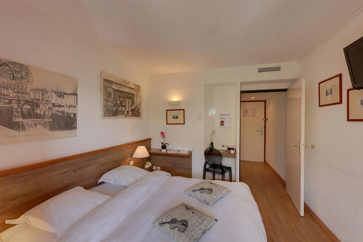 Un ou plusieurs lits dans un hébergement de l'établissement Hotel Le Phoebus Garden & Spa