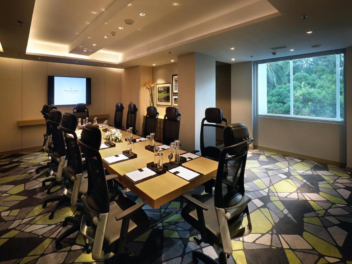 a conference room with a long table and chairs at Welcomhotel by ITC Hotels, RaceCourse, Coimbatore in Coimbatore