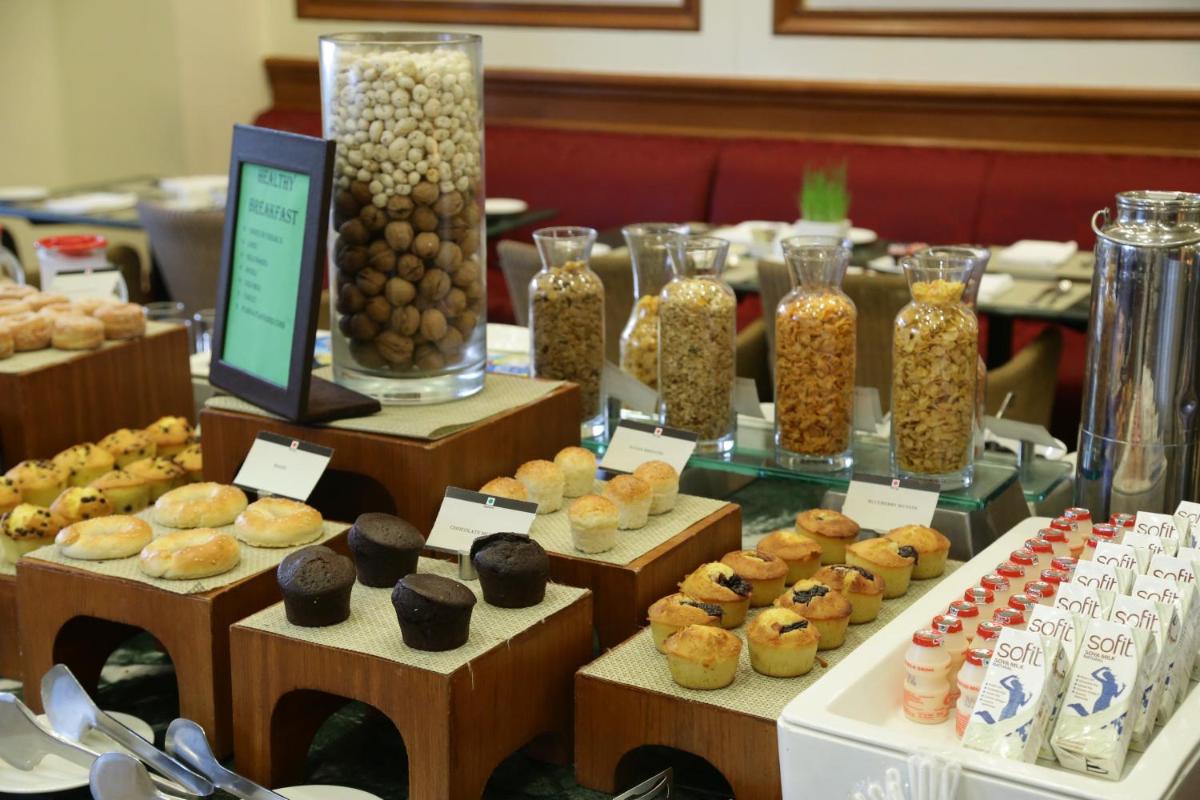 a table filled with lots of different types of food at Eros Hotel New Delhi, Nehru Place in New Delhi a table filled with lots of different types of food at Eros Hotel New Delhi, Nehru Place in New Delhi