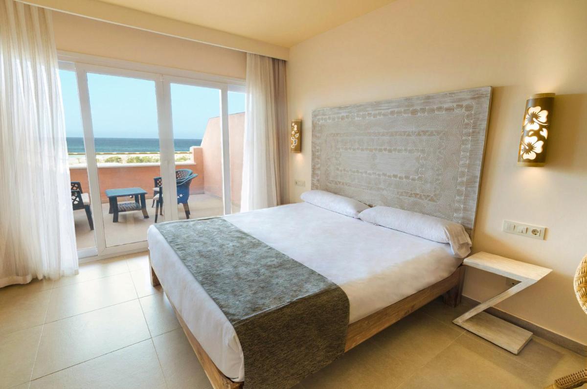 Cama o camas de una habitación en El Cortijo de Zahara by QHotels