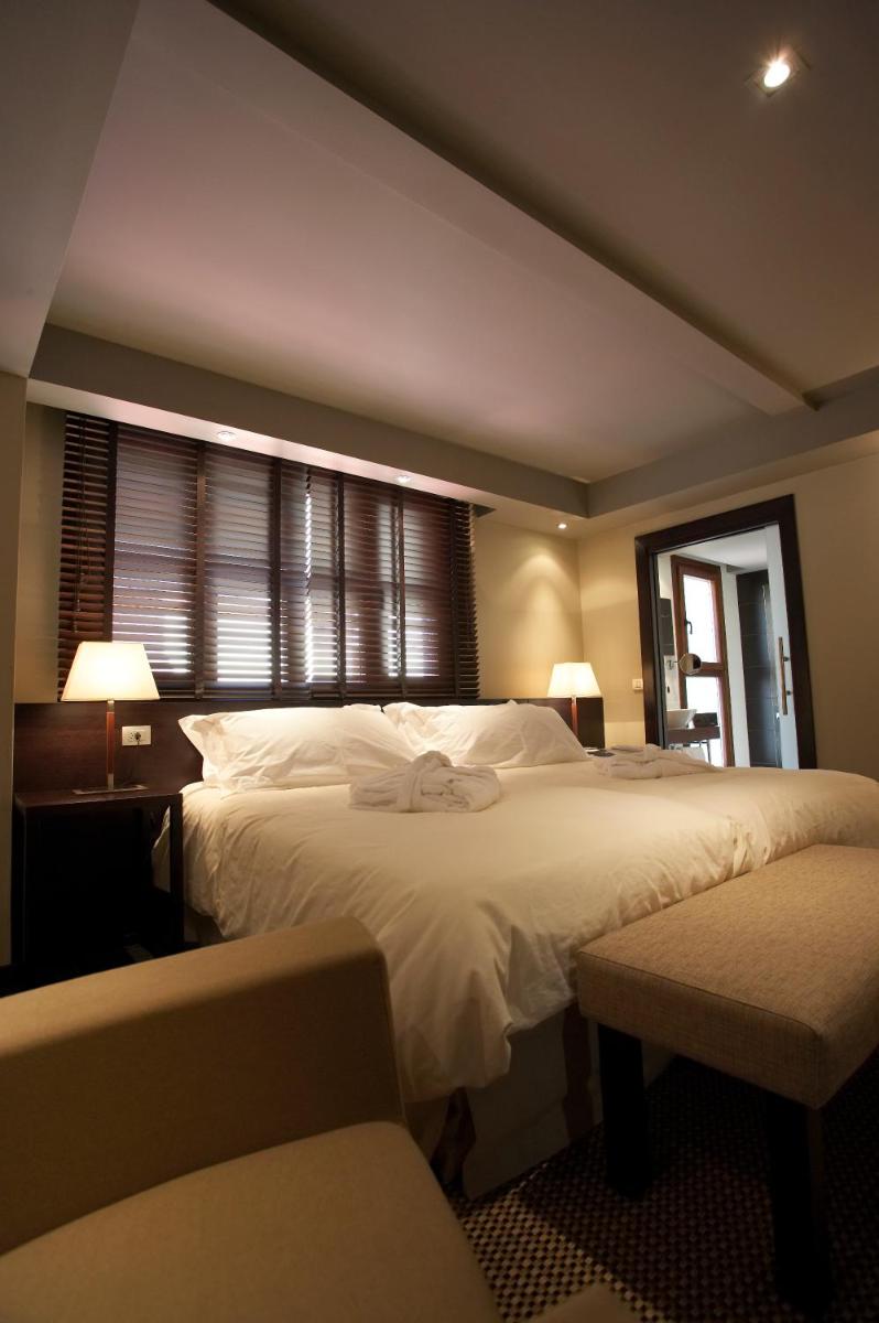 Cama o camas de una habitación en Hotel La Trufa Negra