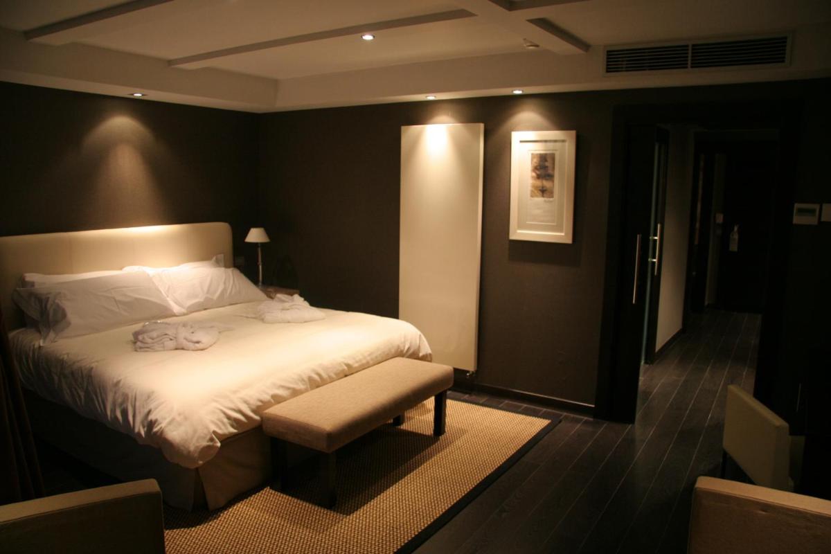 Cama o camas de una habitación en Hotel La Trufa Negra
