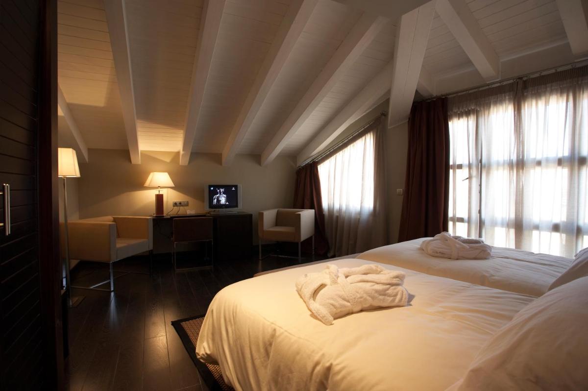 Cama o camas de una habitación en Hotel La Trufa Negra