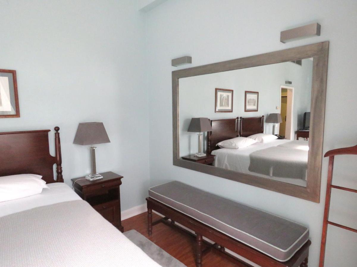 Uma cama ou camas num quarto em Grande Hotel das Caldas da Felgueira
