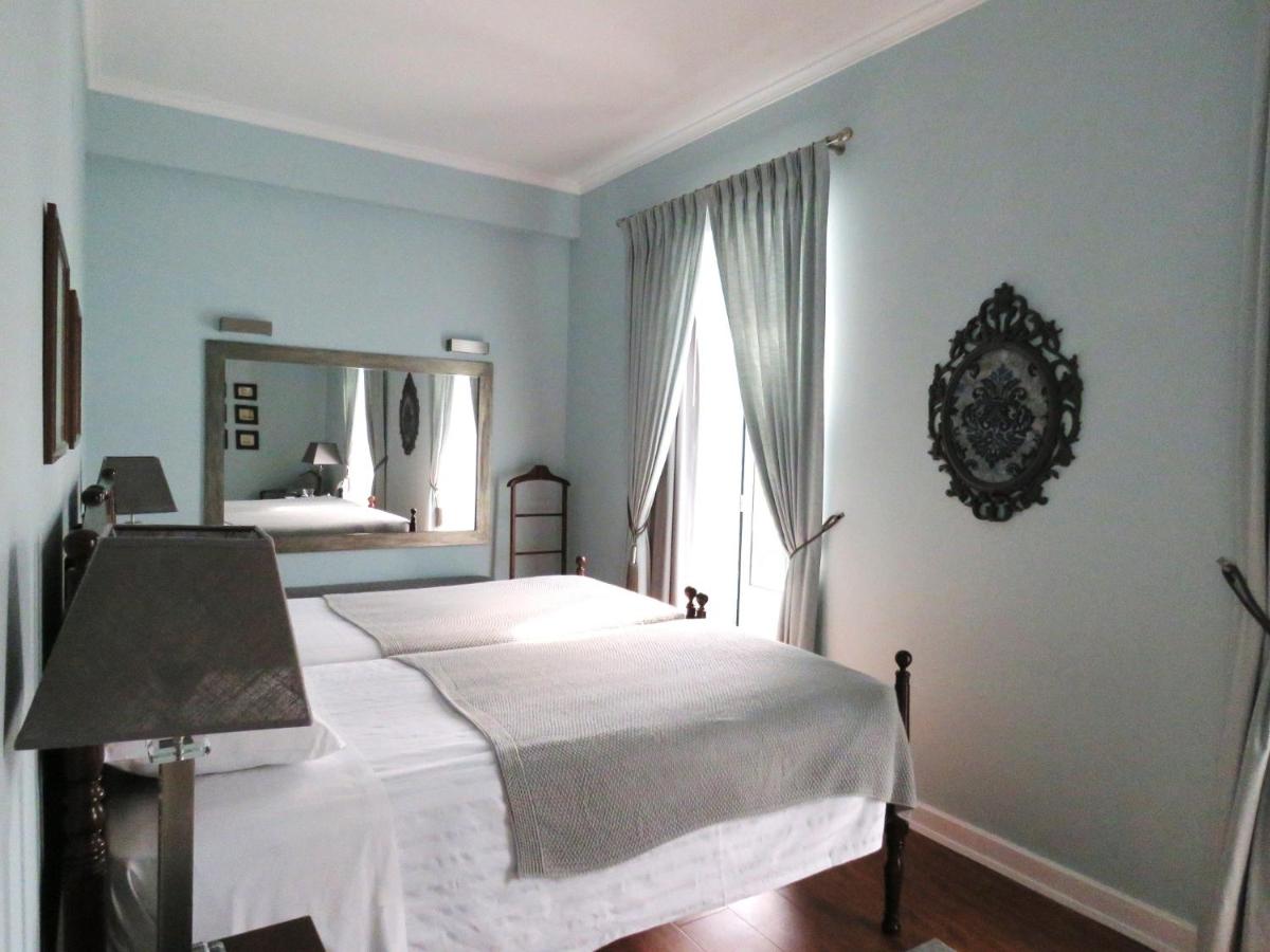 Uma cama ou camas num quarto em Grande Hotel das Caldas da Felgueira