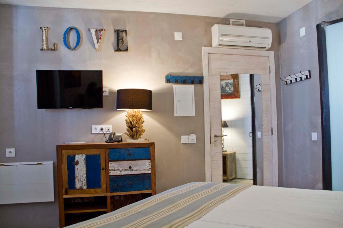Uma cama ou camas num quarto em Surfers Lodge Peniche
