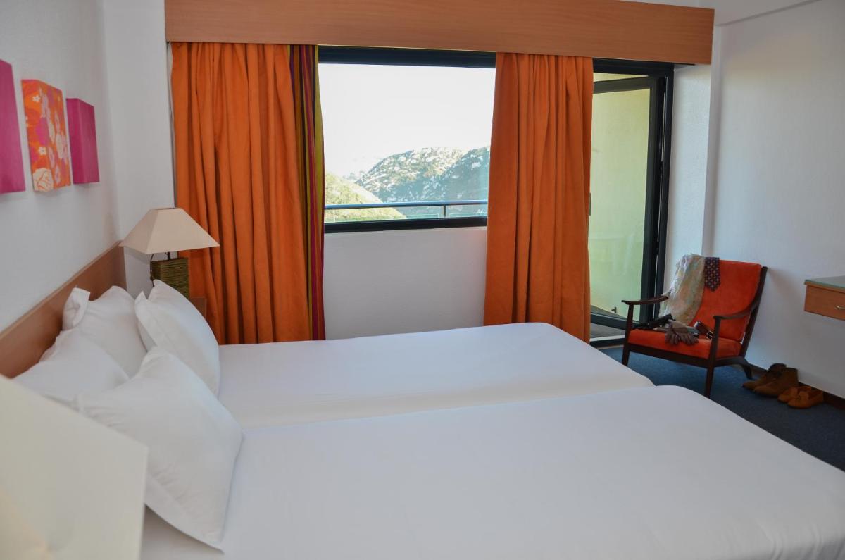 Uma cama ou camas num quarto em Hotel Golf Mar