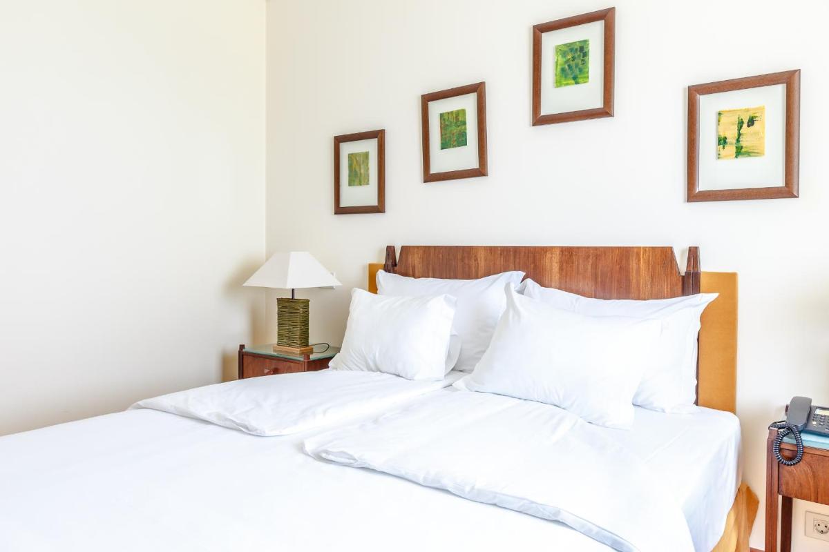 Uma cama ou camas num quarto em Hotel Golf Mar