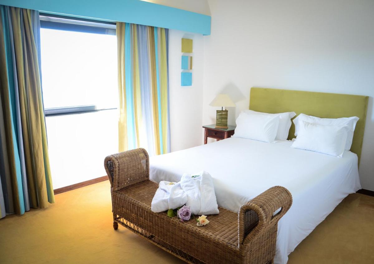 Uma cama ou camas num quarto em Hotel Golf Mar