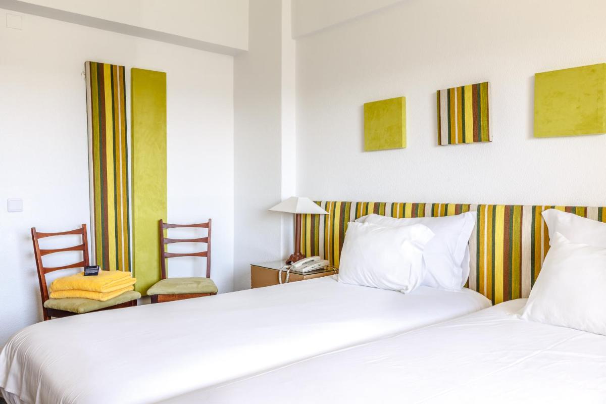 Uma cama ou camas num quarto em Hotel Golf Mar