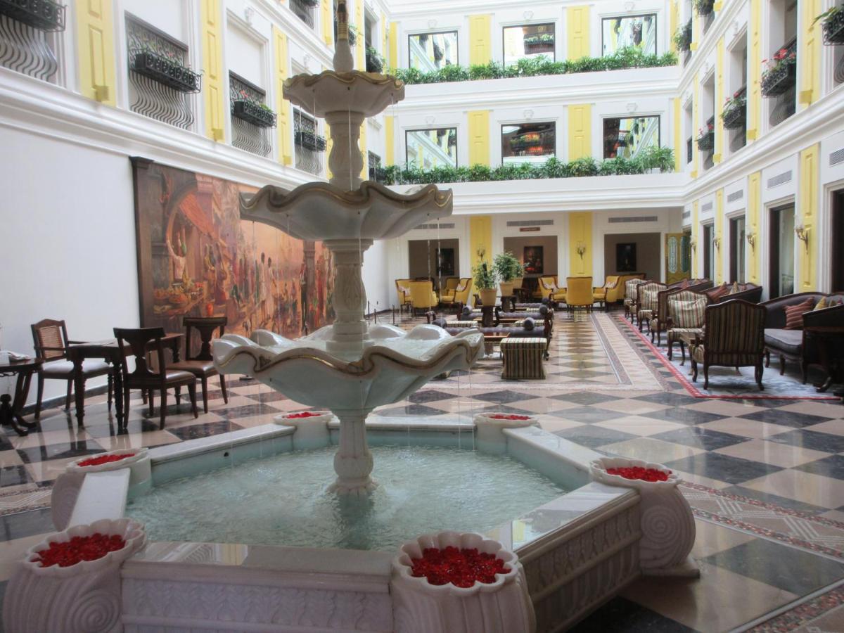 a fountain in the lobby of a hotel at Fragrant Nature Kochi - A Five star Classified Hotel in Cochin
