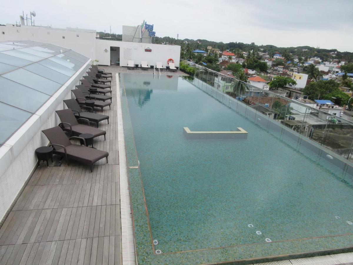 a swimming pool on the roof of a building at Fragrant Nature Kochi - A Five star Classified Hotel in Cochin