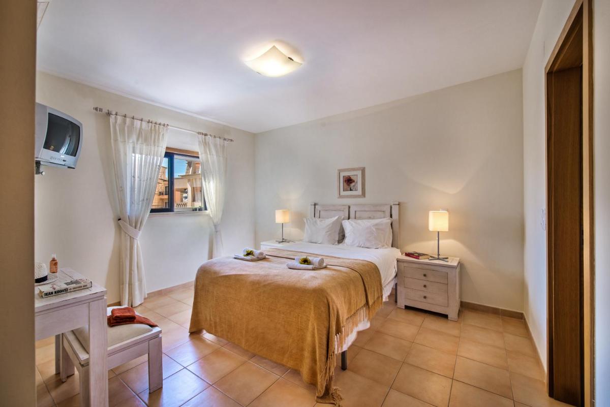 Uma cama ou camas num quarto em Estrela da Luz Resort