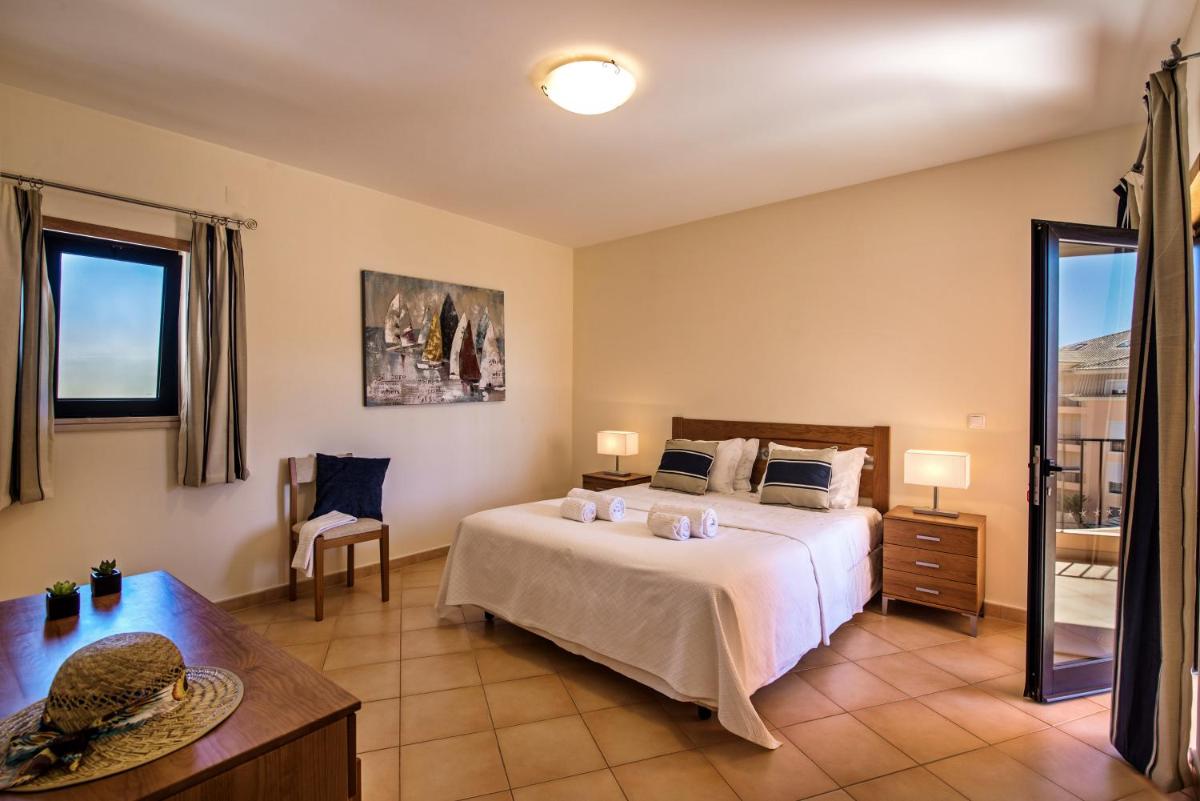 Uma cama ou camas num quarto em Estrela da Luz Resort
