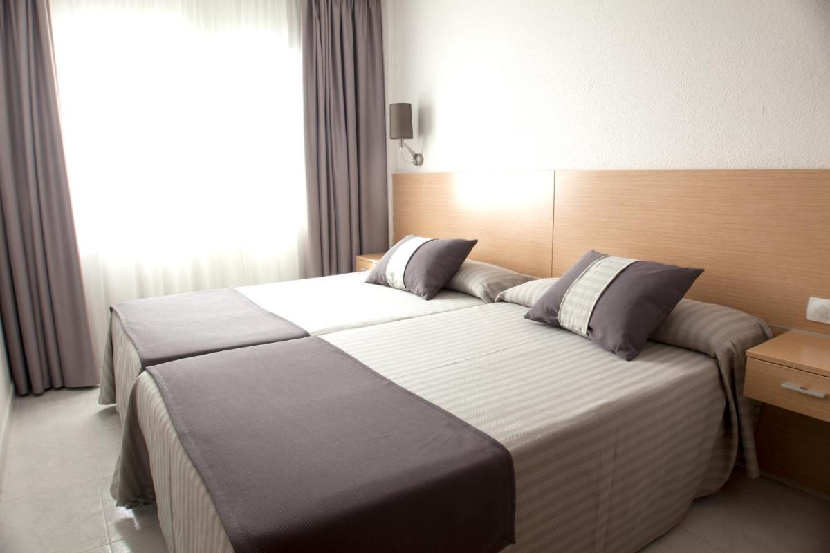 Cama o camas de una habitación en Aparthotel Acuazul