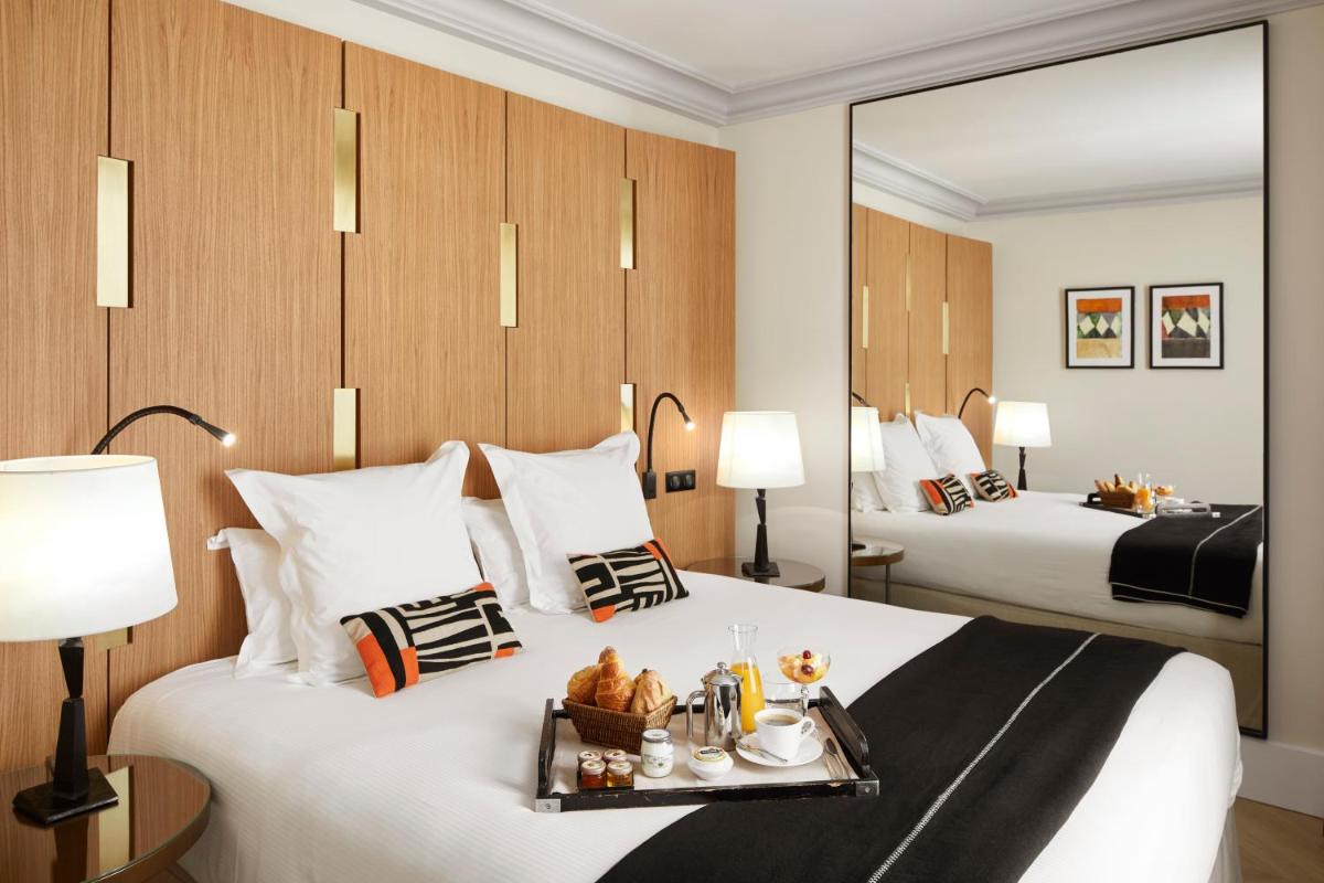 Un ou plusieurs lits dans un hébergement de l'établissement Hotel Montalembert