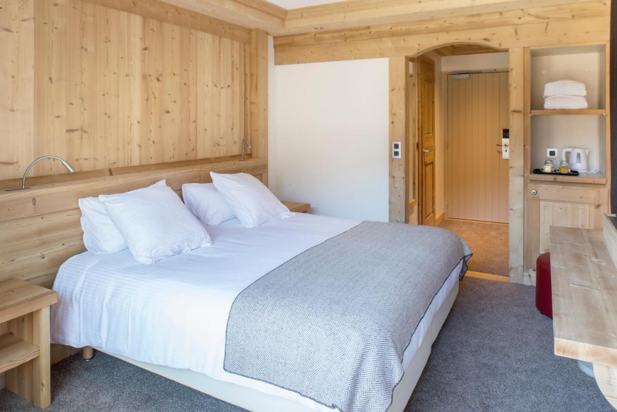 Un ou plusieurs lits dans un hébergement de l'établissement Hotel le Petit Dru