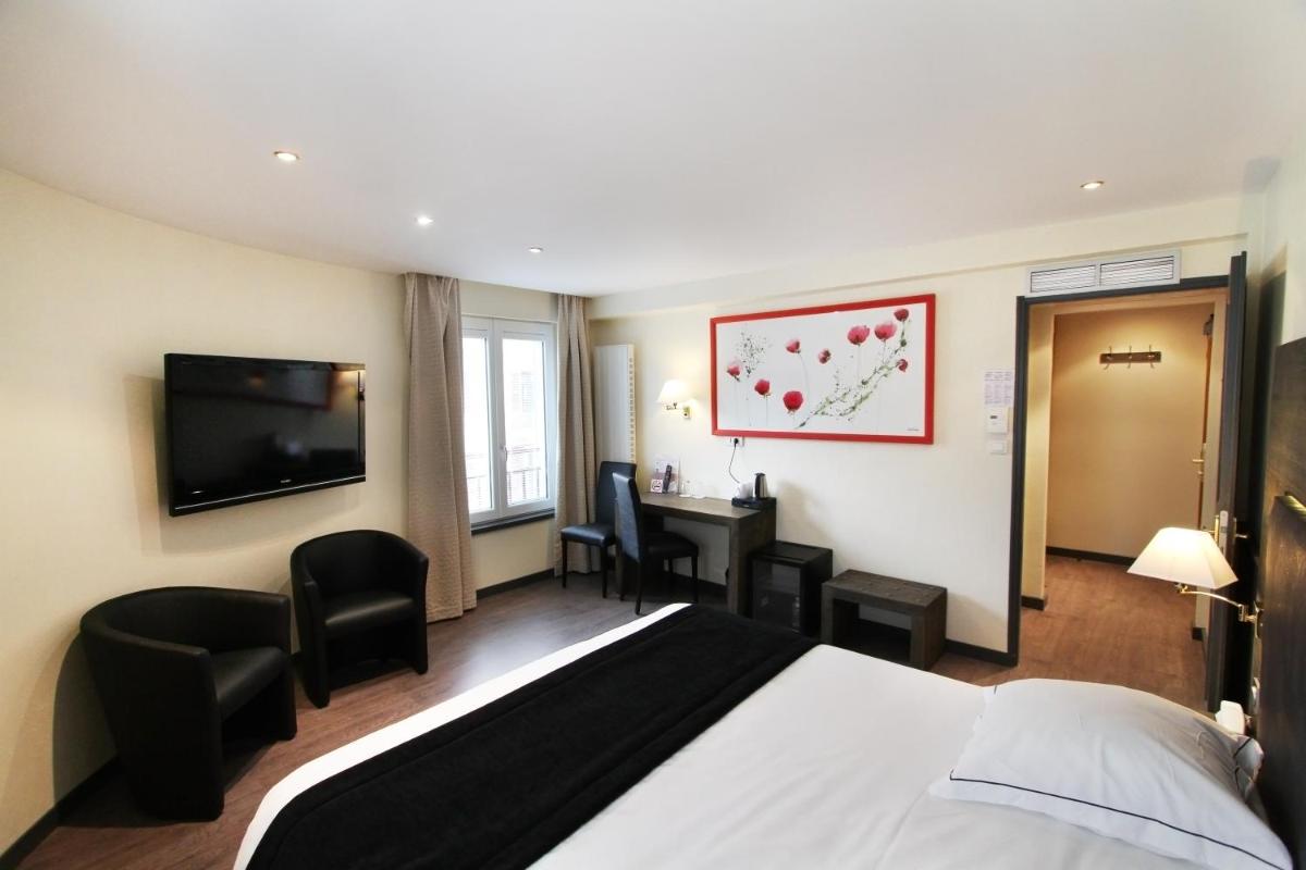 Télévision ou salle de divertissement dans l'établissement Hotel de la Jamagne & Spa