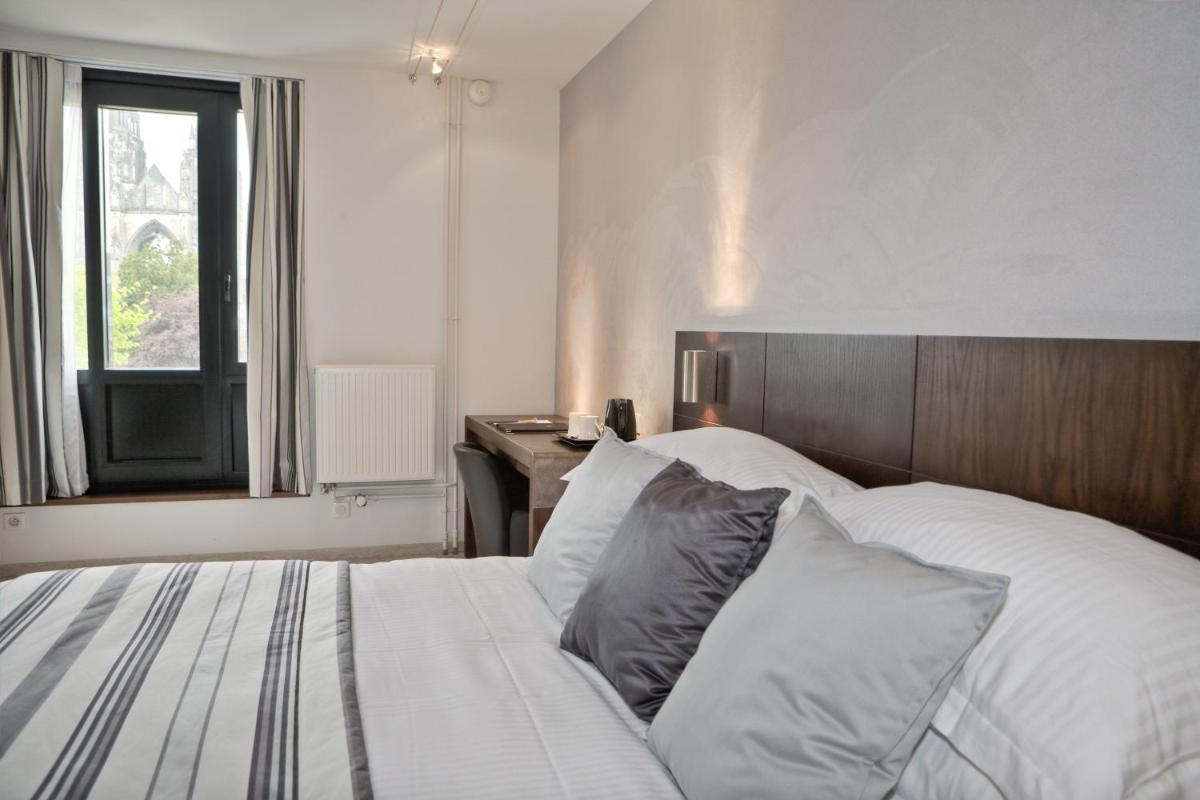Un ou plusieurs lits dans un hébergement de l'établissement Best Western Plus Hotel des Francs