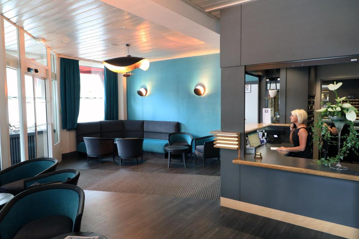 Coin salon dans l'établissement Hotel de la Jamagne & Spa