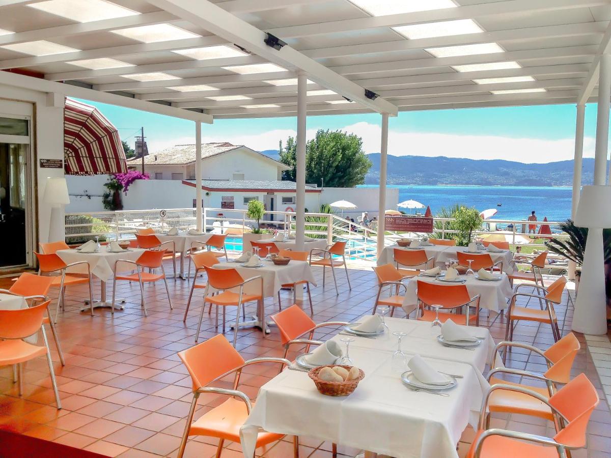 Un restaurante o sitio para comer en Hotel Spa Nanin Playa