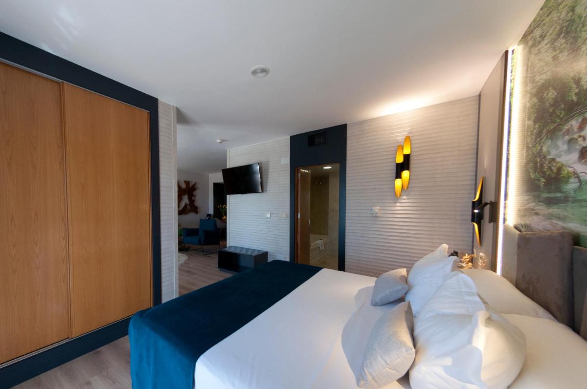 Cama o camas de una habitación en Hotel La Laguna Spa & Golf